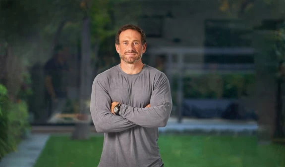 Image of Jason Fox standing with arms folded.
